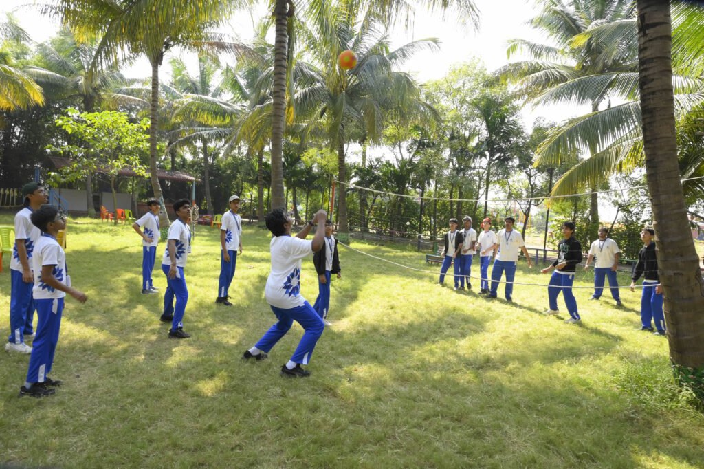 Students playing outdoor sport games during a school picnic at NatureNestt Agro Tourism near Pune